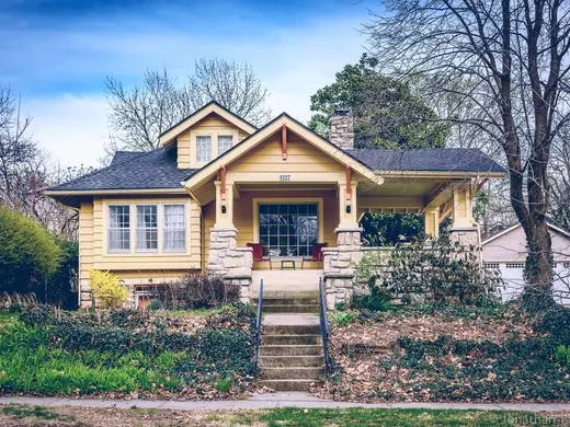 Yellow bungalow with a new roof