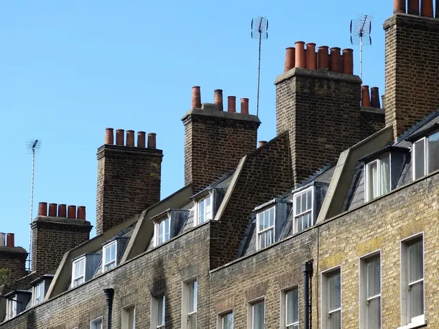 Terrace of stone houses with chimney stacks