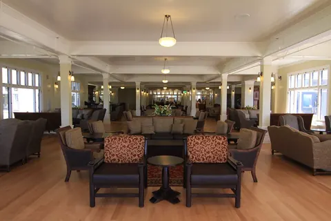 Hotel lounge with armchairs and pendant lights